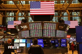 Giao dịch viên tại Sàn chứng khoán New York (Mỹ). (Ảnh: THX/TTXVN)