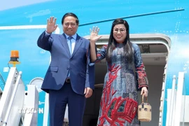 Thủ tướng Phạm Minh Chính và Phu nhân. (Ảnh: Dương Giang/TTXVN)