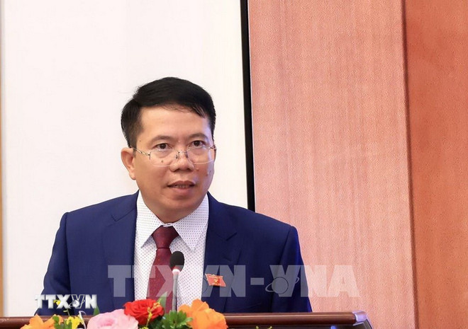 Nestleder for Nasjonalforsamlingens kontor, Nguyen Van Hien, rapporterte om den forventede dagsordenen for den 10. sesjonen i den 15. nasjonalforsamlingen. (Foto: Tuan Anh/VNA) ttxvn-qh.jpg