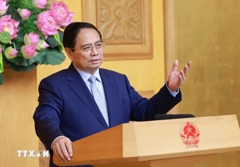 Prime Minister Pham Minh Chinh speaks at a seminar with UK businesses. (Photo: Duong Giang/VNA)