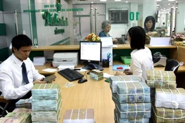 Việc tăng lương nhiều khả năng sẽ kéo theo giá cả tiêu dùng tăng theo. (Nguồn: TTXVN)