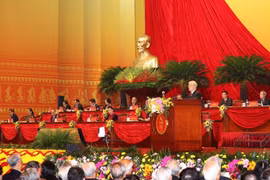 Tổng Bí thư, Chủ tịch nước Nguyễn Phú Trọng đọc Báo cáo chính trị của Ban Chấp hành Trung ương Đảng khóa XII và các văn kiện trình Đại hội. (Ảnh: TTXVN)