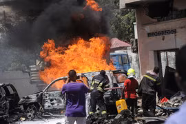 Hiện trường một vụ đánh bom ở Mogadishu, Somalia ngày 29/1. (Ảnh: AFP/TTXVN)