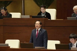 Bộ trưởng Bộ Thông tin và Truyền thông Trương Minh Tuấn trả lời chất vấn của đại biểu Quốc hội. (Ảnh: Phương Hoa/TTXVN)