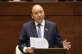 Thủ tướng Nguyễn Xuân Phúc trả lời chất vấn của đại biểu Quốc hội. (Ảnh: Phương Hoa/TTXVN)