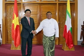 Bộ trưởng Ngoại giao Phạm Bình Minh và Bộ trưởng Ngoại giao Myanmar U Wunna Maung Lwin. (Ảnh: Đỗ Quyên/TTXVN)