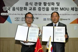 Quang cảnh lễ ký Bản ghi nhớ. (Ảnh: Phạm Duy/Vietnam+)