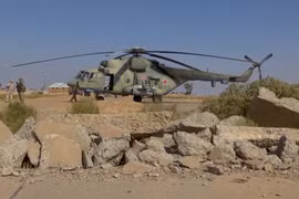 Trực thăng Nga tại căn cứ Tabqa. (Ảnh: AP)