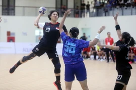 Một pha dứt điểm của cầu thủ Zhong Xinjing, Thái Lan. (Ảnh: Thế Duyệt/TTXVN)
