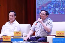 Thủ tướng Phạm Minh Chính đối thoại với công nhân lao động năm 2022. (Ảnh: Dương Giang/TTXVN)