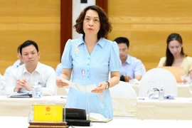 Thứ trưởng Bộ Y tế Nguyễn Thị Liên Hương trả lời các câu hỏi. (Ảnh: Minh Đức/TTXVN)