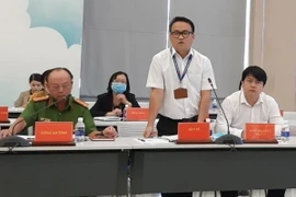 Bác sỹ Huỳnh Minh Chín, Phó Giám đốc Sở Y tế Bình Dương, thông tin với báo chí tại buổi họp. (Ảnh: Chí Tưởng/TTXVN)