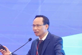 Tiến sỹ Cấn Văn Lực, Chuyên gia Kinh tế trưởng Ngân hàng Đầu tư và Phát triển Việt Nam (BIDV), thành viên Hội đồng Tư vấn chính sách tài chính-tiền tệ quốc gia. (Ảnh: Phạm Kiên/TTXVN)