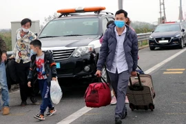 Người lao động về quê ăn Tết. (Ảnh minh họa: Văn Đức/TTXVN) 