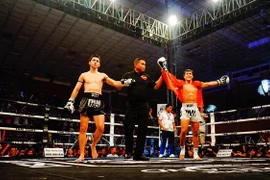 Chiến thắng cho võ sỹ Việt Nam. (Ảnh: Lưu Văn Đạt/Vietnam+)