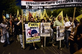 Tuần hành ủng hộ người di cư tại Athens, Hy Lạp ngày 12/9. (Nguồn: AFP/TTXVN)