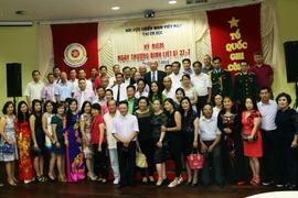 Các đại biểu tham dự Lễ kỷ niệm. (Ảnh: Quang Vinh/Vietnam+)