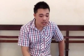 Đối tượng Tuân tại cơ quan công an. (Ảnh: PV/Vietnam+)