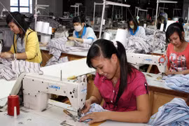 Dệt may sẽ là một trong những ngành hưởng lợi lớn khi TPP được ký kết (Ảnh: TTXVN)