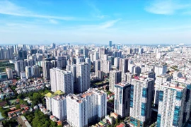 Một phần nguyên nhân diễn biến giá của các cổ phiếu ngành bất động sản giảm sâu là do kết quả kinh doanh của nhóm ngành này thường chậm trong quãng thời gian nửa đầu của năm. (Ảnh: Tuấn Anh/ TTXVN)