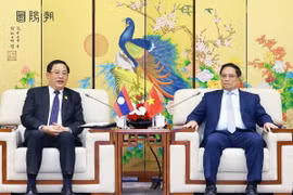 Thủ tướng Phạm Minh Chính tiếp Thủ tướng Lào Sonexay Siphandone. (Ảnh: Dương Giang/TTXVN)