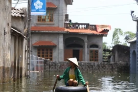 Tình trạng ngập lụt tại Chương Mỹ cuối tháng 7. (Ảnh: Minh Quyết/TTXVN)
