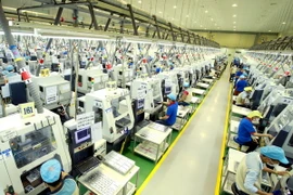 Dây chuyền sản xuất linh kiện điện tử tại Công ty Bokwang Vina (Khu công nghiệp Điềm Thụy). (Ảnh: Hoàng Hùng/TTXVN)