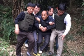 Đối tượng Hạng A Lau bị bắt giữ. (Nguồn: TTXVN)
