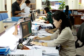 Toàn bộ hoạt động kế toán của Kho bạc Nhà nước Hà Nội hiện sử dụng hệ thống TABMIS trong quản lý thu, chi ngân sách Nhà nước. (Ảnh: Minh Tú/TTXVN)