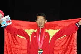 Vận động viên Diệp Ngọc Vũ Minh nhận huy chương vàng. (Ảnh: Quốc Khánh/TTXVN)