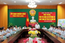 Phó Chủ tịch UBND tỉnh Nguyễn Văn Quang phát biểu tại Hội nghị phân tích đánh giá chỉ số năng lực cạnh tranh cấp tỉnh (PCI) năm 2014, tổ chức ngày 5/6 vừa qua. (Nguồn: vinhlong.gov.vn) 