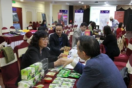 Hoạt động xúc tiến thương mại trong khuôn khổ hội thảo. (Ảnh: Quế Anh/Vietnam+)