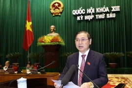 Ông Phan Xuân Dũng, Ủy viên Ủy ban Thường vụ Quốc hội, Chủ nhiệm Ủy ban Khoa học, Công nghệ và Môi trường của Quốc hội trình bày Báo cáo thẩm tra quy hoạch tổng thể về thủy điện. (Ảnh: Doãn Tấn/TTXVN)