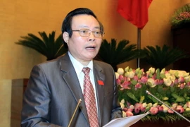 Chủ nhiệm Ủy ban tài chính, ngân sách của Quốc hội Phùng Quốc Hiển trình bày Báo cáo về dự thảo Luật kiểm toán nhà nước (sửa đổi). (Ảnh: An Đăng/TTXVN)