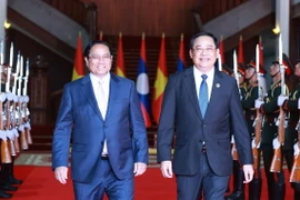 Thủ tướng Phạm Minh Chính hội kiến Thủ tướng Lào Sonexay Siphandone, Chủ tịch ASEAN 2024. (Ảnh: Dương Giang/TTXVN)