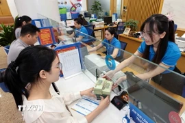 Hoạt động tín dụng ngân hàng. (Nguồn: TTXVN)
