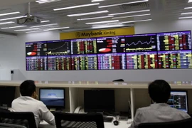 Giao dịch chứng khoán tại Sàn Maybank KimEng (Thành phố Hồ Chí Minh). (Ảnh: Hoàng Hải/TTXVN)