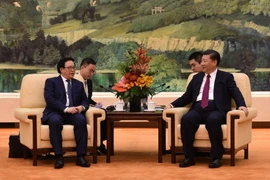 Tổng Bí thư Đảng Cộng sản Trung Quốc Tập Cận Bình tiếp ông Hoàng Bình Quân, Trưởng ban Đối ngoại Trung ương, Đặc phái viên của Tổng Bí thư Nguyễn Phú Trọng. (Ảnh: Minh Châu/TTXVN)