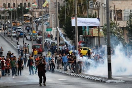 Người biểu tình Palestine xung đột với cảnh sát Israel tại khu vực Bethlehem thuộc Bờ Tây ngày 19/7. (Nguồn: AFP/TTXVN)