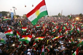 Cộng đồng người Kurd ở Iraq tham gia cuộc tuần hành kêu gọi người dân tham gia cuộc trưng cầu dân ý sắp tới tại thủ phủ Arbil ngày 16/9. (Nguồn: AFP/TTXVN)