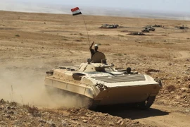  Các lực lượng Iraq tiến về thành phố Tal Afar, thành trì cuối cùng của IS tại Iraq, ngày 21/8. (Nguồn: AFP/TTXVN)