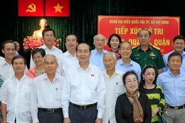 Chủ tịch nước Trần Đại Quang tiếp xúc cử tri quận 1, quận 3 và quận 4 để thông báo kết quả kỳ họp thứ 4, Quốc hội khóa 14. (Ảnh: Nhan Sáng/TTXVN)