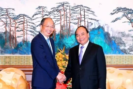 Thủ tướng Nguyễn Xuân Phúc tiếp Chủ tịch Ngân hàng Công Thương Trung Quốc, Dịch Hội Mãn. (Ảnh: Thống Nhất/TTXVN)