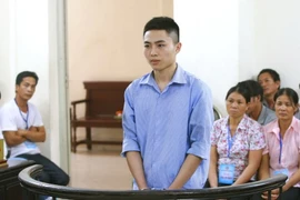Bị cáo Vũ Văn Bình đứng trước vành móng ngựa. (Ảnh: Doãn Tấn/TTXVN)