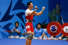 Lực sỹ cử tạ Thạch Kim Tuấn thi đấu không thành công ở Olympic 2016. (Nguồn: Reuters)