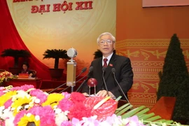 Tổng Bí thư Nguyễn Phú Trọng đọc Báo cáo của Ban Chấp hành Trung ương Đảng khóa XI về các văn kiện trình Đại hội XII của Đảng. (Nguồn: TTXVN)