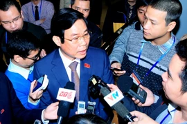 Đồng chí Nguyễn Bắc Son, Bộ trưởng Bộ Thông tin và Truyền thông trả lời phỏng vấn các cơ quan thông tấn, báo chí bên lề Đại hội XII của Đảng. (Nguồn: TTXVN)