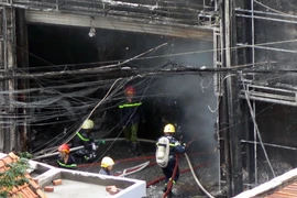 Hiện trường vụ cháy gara sửa chữa ôtô giữa trung tâm Thành phố Hồ Chí Minh, ngày 30/1. Ảnh minh họa. (Ảnh: Hoàng Hải/TTXVN)