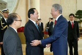 Chủ tịch nước Trần Đại Quang tiếp Phó Thủ tướng Singapore Tiêu Chí Hiền. (Ảnh: Nhan Sáng/TTXVN)