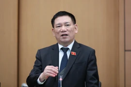 Bộ trưởng Bộ Tài chính Hồ Đức Phớc trao đổi về công tác triển khai các nhiệm vụ của Bộ trong năm 2023. (Ảnh: Vietnam+)